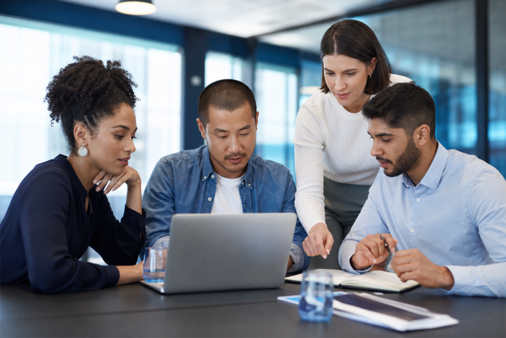 Small business team reviewing accessible web design planning in a modern office