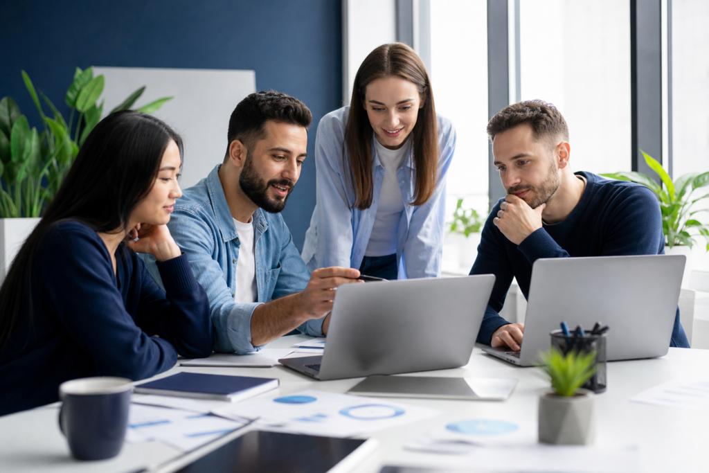 Startup team planning web development outsourcing for faster growth
