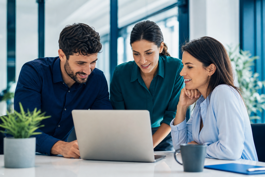 Small business team reviewing accessible web design ROI metrics on a laptop