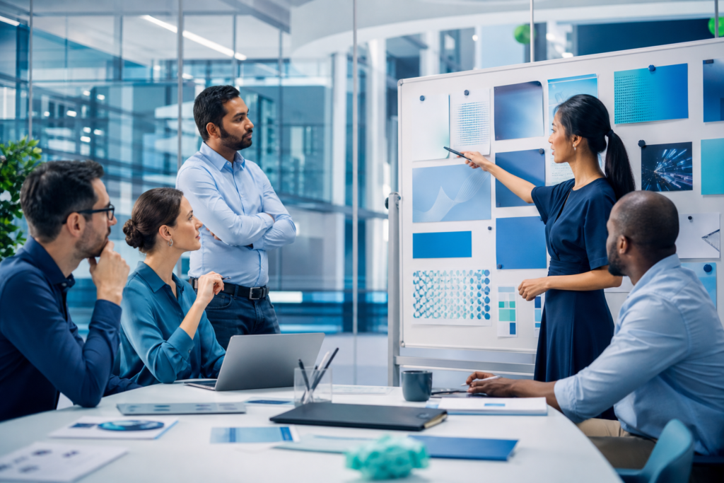 Business team discussing upskilling and reskilling strategy in a modern meeting room