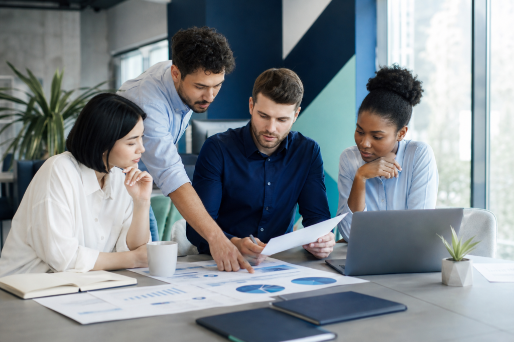 Startup team planning a website budget in a modern workspace